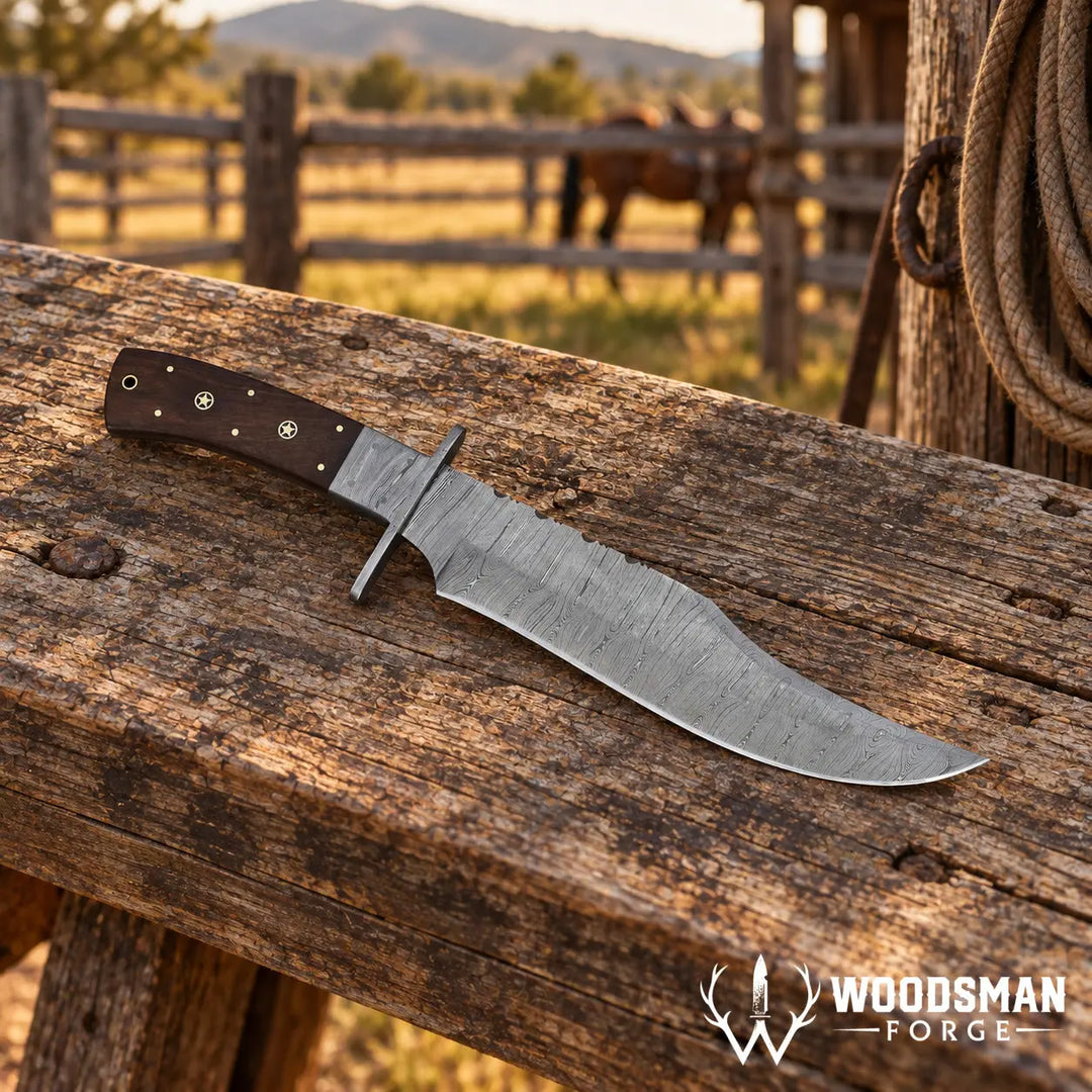 A large fixed-blade knife with a textured silver blade and a dark brown handle lies on a weathered wooden fence rail in an outdoor ranch setting with a blurred horse and fence in the background. The Woodman Forge logo is visible in the bottom right corner.